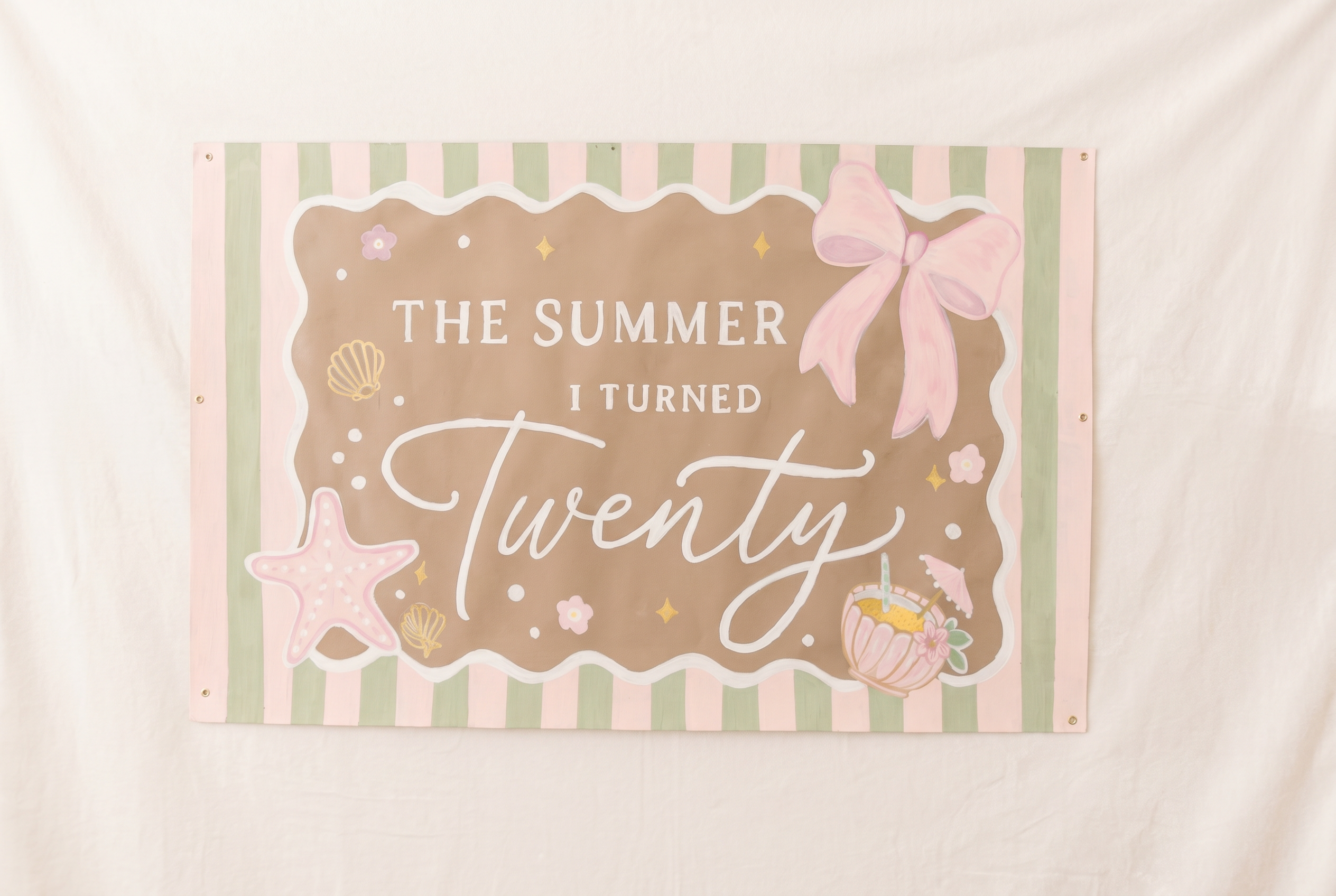 Hand-painted custom birthday banner with pink and sage stripes, bow, and sea shell details